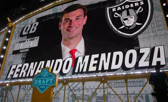 Indiana quarterback Fernando Mendoza is shown on a screen after being chosen by the Las Vegas Raiders with the first overall pick during the first round of the NFL football draft, Thursday, April 23, 2026, in Pittsburgh. (AP Photo/Gene J. Puskar)