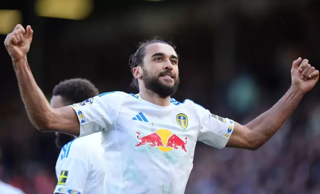 Leeds United's Dominic Calvert-Lewin celebrates after scoring their third goal of the game from the penalty spot during the English Premier League soccer match between Leeds United and Wolverhampton Wanderers, Saturday April 18, 2026, in Leeds, England. (Mike Egerton/PA via AP)