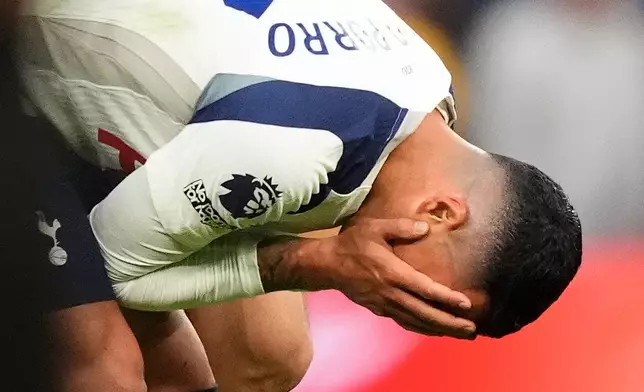 Tottenham Hotspur's Pedro Porro appears dejected after the final whistle of an English Premier League soccer match between Tottenham Hotspur and Brighton and Hove Albion, Saturday, April 18, 2026, in London. (Jordan Pettitt/PA via AP)
