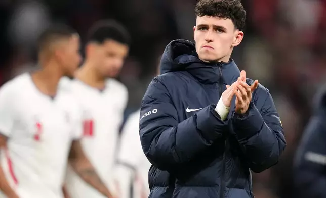 England's Phil Foden reacts after his team lost the International friendly soccer match between England and Japan in London, Tuesday, March 31, 2026 . (AP Photo/Kirsty Wigglesworth)