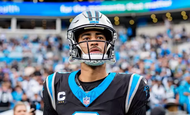 FILE - Carolina Panthers quarterback Bryce Young (9) looks on before an NFL wild-card playoff football game between the Carolina Panthers and the Los Angeles Rams, Jan. 10, 2026, in Charlotte, N.C. (AP Photo/Jacob Kupferman, File)