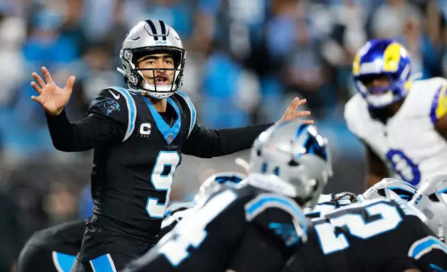 FILE - Carolina Panthers quarterback Bryce Young calls a play during the second half of an NFL wild-card playoff football game against the Los Angeles Rams, Jan. 10, 2026, in Charlotte, N.C. (AP Photo/Rusty Jones, File)