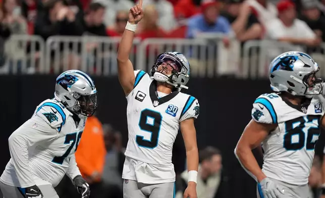 FILE - Carolina Panthers quarterback Bryce Young celebrates after scoring against the Atlanta Falcons during the second half of an NFL football game Jan. 5, 2025, in Atlanta. (AP Photo/Brynn Anderson, File)