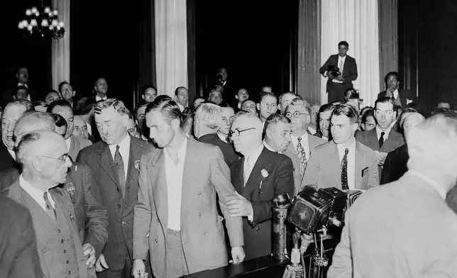 FILE - Bruno Richard Hauptmann being takent to his cell after being arraigned in New York on Sept. 27, 1934. (AP Photo, File)