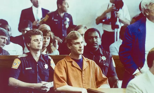 FILE - Suspected serial killer Jeffrey L. Dahmer sits in court for a hearing where he was charged with eight additional counts of first degree intentional homicide, bringing the total to 12, Aug. 7, 1991. (AP Photo/Jack Orton/Pool, File)