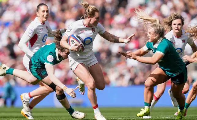 England's Megan Jones, center, in action during the Women's Six Nations Rugby 2026 match, in London, Saturday, April 11, 2026. (Andrew Matthews/PA via AP)