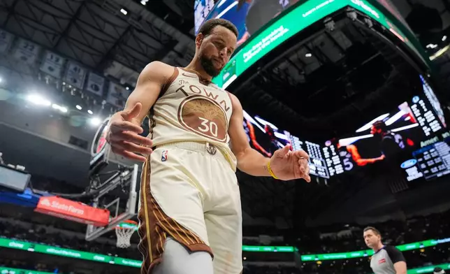 FILE - Golden State Warriors' Stephen Curry looks down during the second half of an NBA basketball game against the Dallas Mavericks, in Dallas, Jan. 22, 2026. (AP Photo/Tony Gutierrez, File)