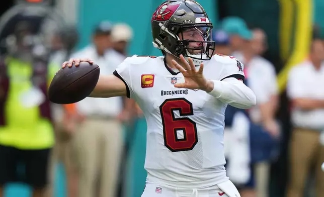 FILE - Tampa Bay Buccaneers quarterback Baker Mayfield (6) looks to pass during the first half of an NFL football game against the Miami Dolphins, Sunday, Dec. 28, 2025, in Miami Gardens, Fla. (AP Photo/Lynne Sladky, File)