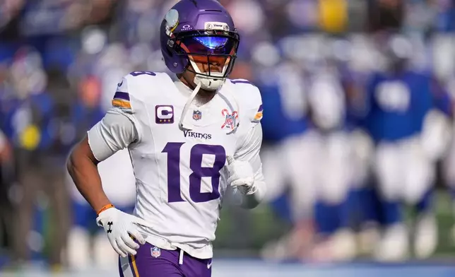 FILE - Minnesota Vikings wide receiver Justin Jefferson (18) before an NFL football game against the New York Giants, Sunday, Dec. 21, 2025, in East Rutherford, N.J. (AP Photo/Seth Wenig, File)