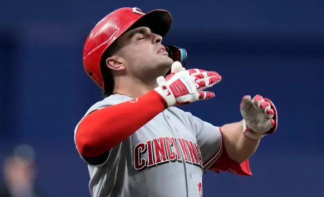 Cincinnati Reds' Sal Stewart celebrates as he runs the bases following hit two-run home run off Tampa Bay Rays pitcher Jesse Scholtens during the first inning of a baseball game Monday, April 20, 2026, in St. Petersburg, Fla. (AP Photo/Chris O'Meara)