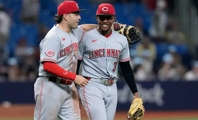 Cincinnati Reds first baseman Sal Stewart and third baseman Ke'bryan Hayes (3) celebrate after the team defeated the Tampa Bay Rays during a baseball game Monday, April 20, 2026, in St. Petersburg, Fla. (AP Photo/Chris O'Meara)