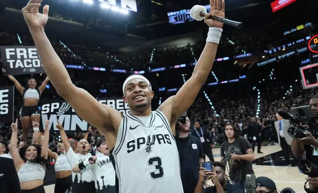 San Antonio Spurs forward/guard Keldon Johnson (3) celebrates after Game 5 of a first-round NBA playoffs basketball series against the Portland Trail Blazers in San Antonio, Tuesday, April 28, 2026. (AP Photo/Eric Gay)