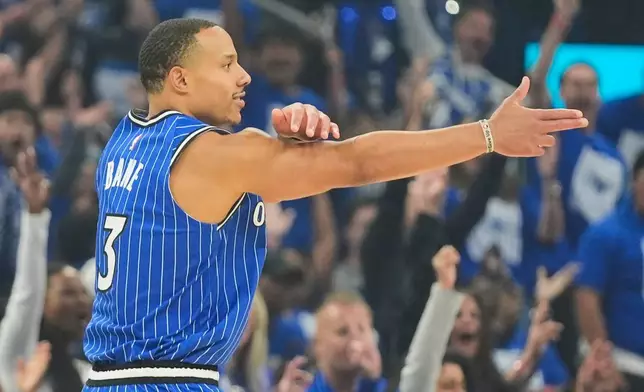 Orlando Magic guard Desmond Bane (3) points to teammates after sinking a 3-point shot against the Detroit Pistons during the first half in Game 4 of a first-round NBA basketball playoff series, Monday, April 27, 2026, in Orlando, Fla. (AP Photo/John Raoux)