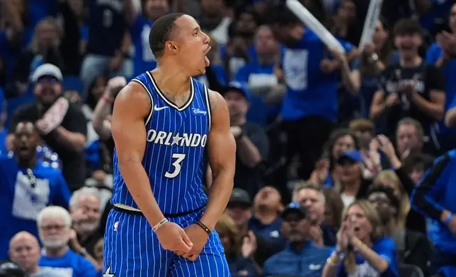 Orlando Magic guard Desmond Bane (3) cheers with fans after a Detroit Pistons turnover during the second half in Game 4 of a first-round NBA basketball playoff series, Monday, April 27, 2026, in Orlando, Fla. (AP Photo/John Raoux)