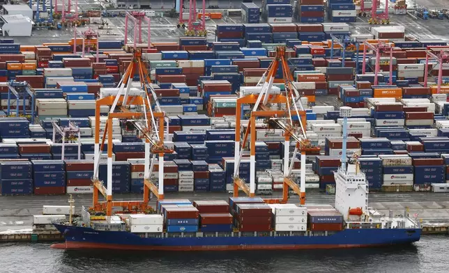 Containers are stacked at a port in Yokohama, near Tokyo on Aug. 1, 2025. (Takuto Kaneko/Kyodo News via AP)
