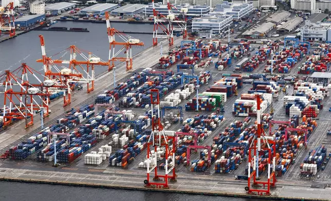 Containers are stacked at a port in Yokohama, near Tokyo on Aug. 1, 2025. (Takuto Kaneko/Kyodo News via AP)
