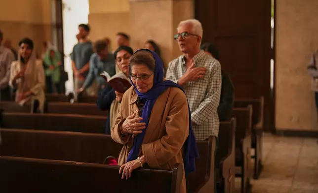 Worshippers attend Easter Sunday Mass at Saint Sarkis Cathedral, an Armenian Apostolic church, in Tehran, Iran, Sunday, April 5, 2026. (AP Photo/Francisco Seco)