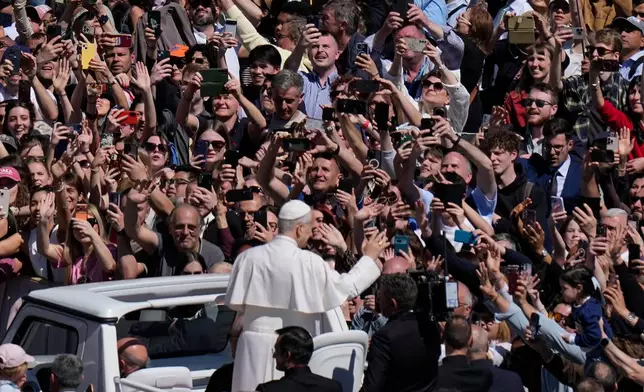 Pope Leo XIV greets the faithful at the end of Easter Mass he presided over in St. Peter's Square at the Vatican, Sunday, April 5, 2026. (AP Photo/Alessandra Tarantino)