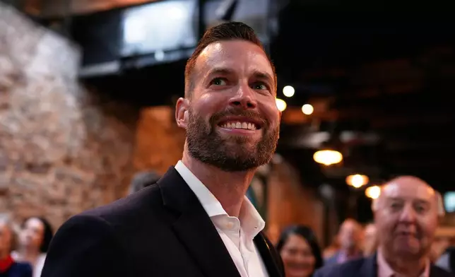 Republican candidate Clay Fuller smiles as election results roll in during an election night watch party, Tuesday, April 7, 2026, in Ringgold, Ga. (AP Photo/Mike Stewart)