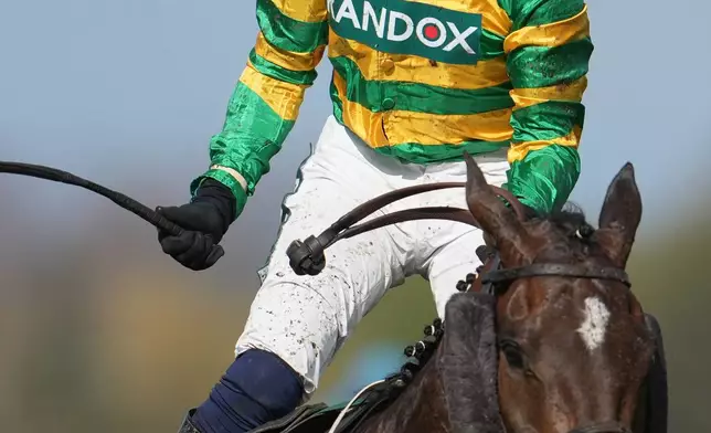 FILE - Jockey Paul Townend celebrates on I Am Maximus after winning the Grand National horse race at Aintree racecourse in Liverpool, April 11, 2026. (AP Photo/Jon Super, File)