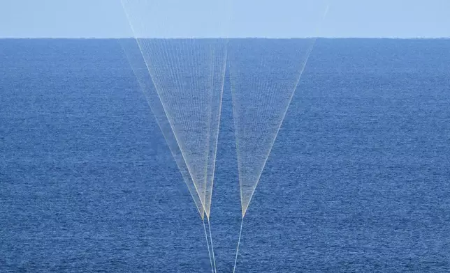 FILE - In this photo provided by NASA, NASA's Orion capsule splashes down in the Pacific Ocean off the coast of California, following the Artemis II mission on April 10, 2026. (Josh Valcarcel/NASA via AP, File)