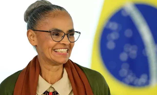 FILE - Brazil's Environment Minister Marina Silva smiles during a decree-signing ceremony on Environment Day at the Planalto Palace in Brasilia, Brazil, June 3, 2025. (AP Photo/Eraldo Peres, File)