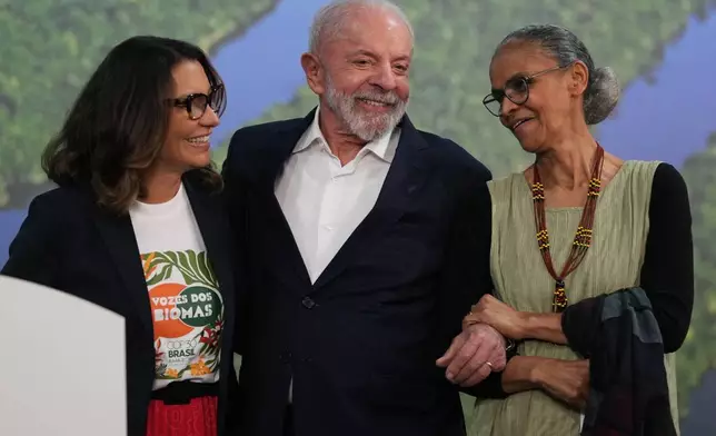 FILE - Brazil President Luiz Inacio Lula da Silva, center, attends a news conference with his wife Rosangela da Silva, left, and Marina Silva, Brazil environment minister, at the COP30 U.N. Climate Summit, Nov. 19, 2025, in Belem, Brazil. (AP Photo/Andre Penner, File)