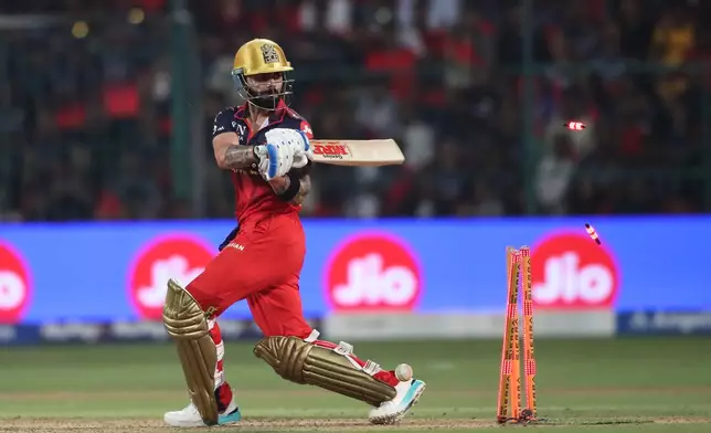 Royal Challengers Bengaluru's Virat Kohli clean bowled by Gujarat Titans' Jason Holder during the Indian Premier League cricket match between Royal Challengers Bengaluru and Gujarat Titans in Bengaluru, India, Friday, April 24, 2026. (AP Photo)