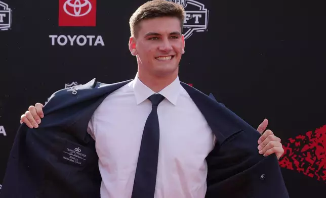 Alabama quarterback Ty Simpson poses on the red carpet before the first round of the NFL football draft, Thursday, April 23, 2026, in Pittsburgh. (AP Photo/Gene J. Puskar)