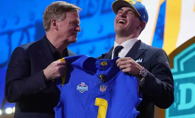 Alabama quarterback Ty Simpson poses with NFL Commissioner Roger Goodell after being chosen by the Los Angeles Rams with the 13th overall pick during the first round of the NFL football draft, Thursday, April 23, 2026, in Pittsburgh. (AP Photo/Gene J. Puskar)