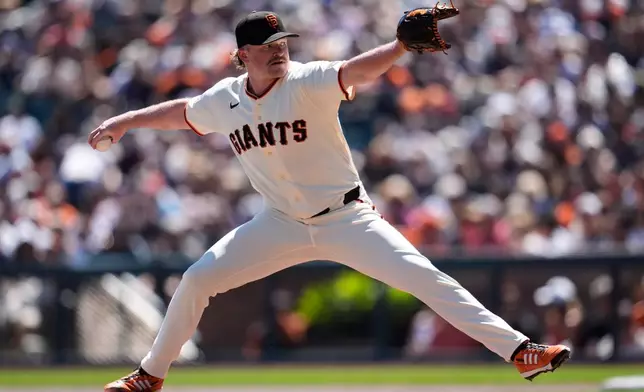 San Francisco Giants pitcher Logan Webb throws against the New York Mets during the first inning of a baseball game in San Francisco, Sunday, April 5, 2026. (AP Photo/Jeff Chiu)
