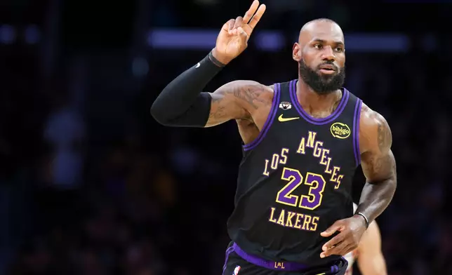 Los Angeles Lakers forward LeBron James gestures after making a basket against the Phoenix Suns during the first half of an NBA basketball game, Friday, April 10, 2026, in Los Angeles. (AP Photo/Jessie Alcheh)