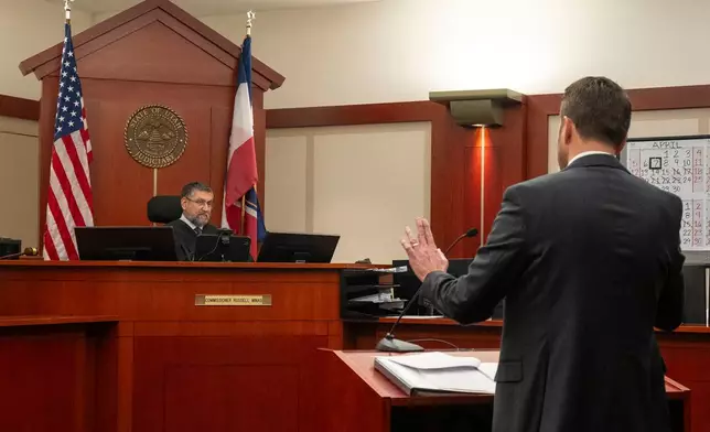 Commissioner Russell Minas listens as attorney Eric Swinyard speaks during a hearing on a protective order sought by a former partner against Taylor Frankie Paul, in 3rd District Court, in Salt Lake City, Tuesday, April 7, 2026. (Rick Egan/The Salt Lake Tribune via AP, Pool)