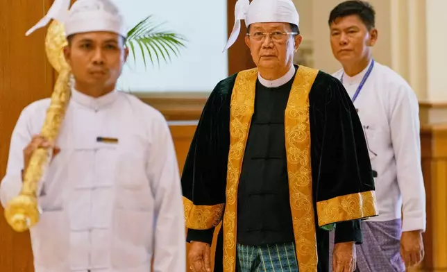 Parliament chairman Aung Lin Dwe, center, arrives for a session of Union Parliament in Naypyitaw, Myanmar, Friday, April 3, 2026. (AP Photo/Aung Shine Oo)