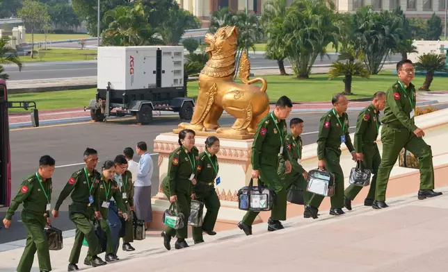 Myanmar's military representatives arrive for a session at Union parliament in Naypyitaw, Myanmar, Friday, April 3, 2026. (AP Photo/Aung Shine Oo)