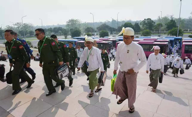 Myanmar's military representatives and lawmakers arrive to attend a session at Union parliament in Naypyitaw, Myanmar, Friday, April 3, 2026.(AP Photo/Aung Shine Oo)