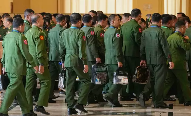 Myanmar's military representatives arrive for a session at Union parliament in Naypyitaw, Myanmar, Thursday, April 2, 2026. (AP Photo/Aung Shine Oo)