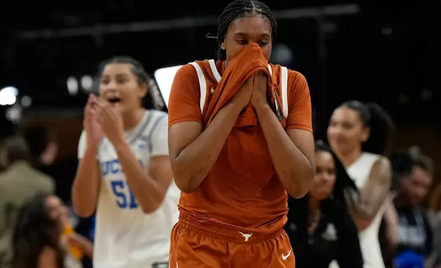 Texas forward Madison Booker (35) reacts after Texas lost to UCLA in a women's NCAA college basketball tournament semifinal game at the Final Four, Friday, April 3, 2026, in Phoenix. (AP Photo/Ross D. Franklin)