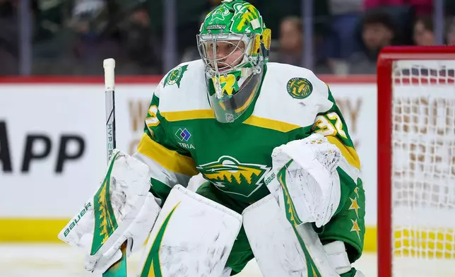Minnesota Wild goaltender Filip Gustavsson defends his net against the Vancouver Canucks during the second period of an NHL hockey game Thursday, April 2, 2026, in St. Paul, Minn. (AP Photo/Matt Krohn)