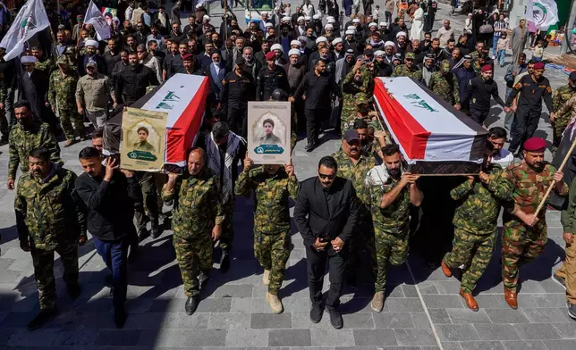 FILE - Members of the Popular Mobilization Forces attend a funeral for colleagues who were killed in a U.S. airstrike in Anbar, in Najaf, Iraq, Wednesday, April 1, 2026. (AP Photo/Anmar Khalil, File)
