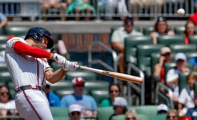 Atlanta Braves' Matt Olson hits a three-run home run against the Philadelphia Phillies during the first inning of a baseball game, Sunday, April 26, 2026, in Atlanta. (AP Photo/Erik S. Lesser)