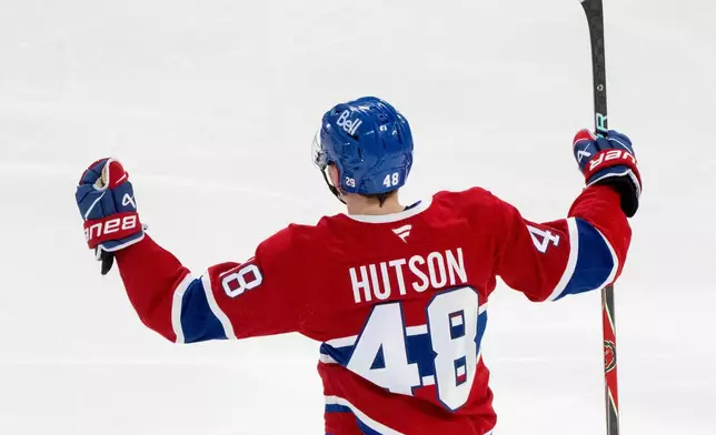 Montreal Canadiens' Lane Hutson celebrates after his winning goal against the Tampa Bay Lightning during overtime of Game 3 in a first-round NHL hockey Stanley Cup playoff series in Montreal, Friday, April 24, 2026. (Christinne Muschi/The Canadian Press via AP)