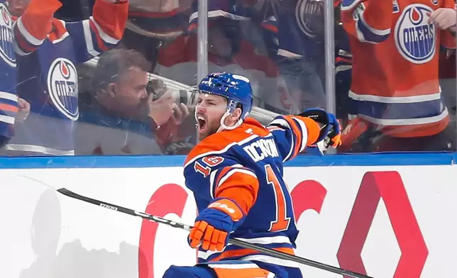 Edmonton Oilers' Jason Dickinson (16) celebrates a goal against the Anaheim Ducks during the first period of an NHL playoff game in Edmonton on Monday, April 20, 2026. (Codie McLachlan/The Canadian Press via AP)