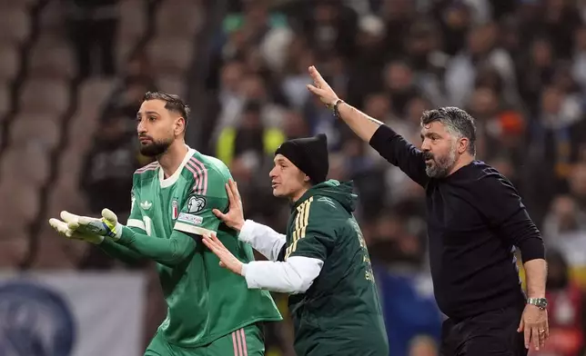 Italy's, from left, Gianluigi Donnarumma, Nicolò Barella and coach Gennaro Gattuso react during the World Cup qualifying playoff final soccer match between Bosnia and Italy in Zenica, Bosnia, Tuesday, March 31, 2026. (Fabio Ferrari/LaPresse via AP)