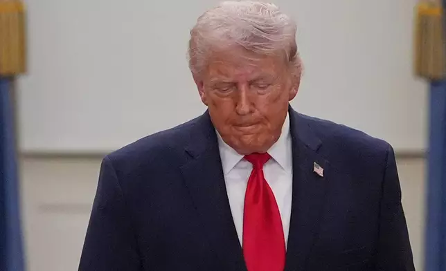 President Donald Trump walks from the Blue Room to speak about the Iran war from the Cross Hall of the White House on Wednesday, April 1, 2026, in Washington. (AP Photo/Alex Brandon, Pool)