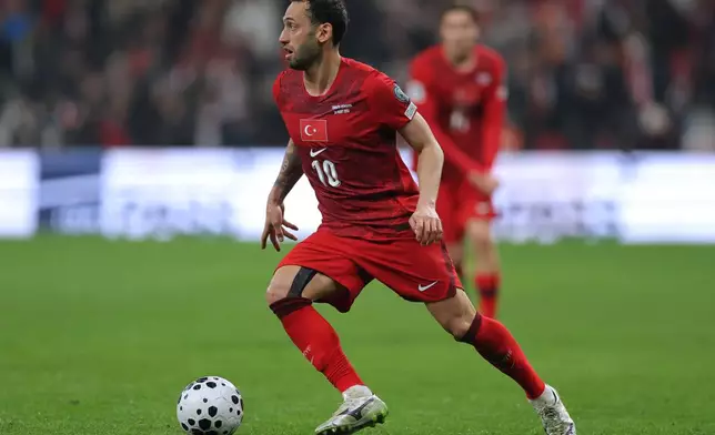 FILE - Turkey's Hakan Calhanoglu controls the ball during the 2026 World Cup playoff semifinal soccer match between Turkey and Romania, in Istanbul, Turkey, Thursday, March 26, 2026. (AP Photo, File)
