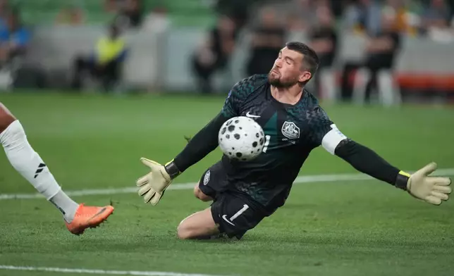 FILE - Australia's goalkeeper Matthew Ryan makes a save during their international soccer friendly against Curacao in Melbourne, Australia, Tuesday, March 31, 2026. (AP Photo/Asanka Brendon Ratnayake)