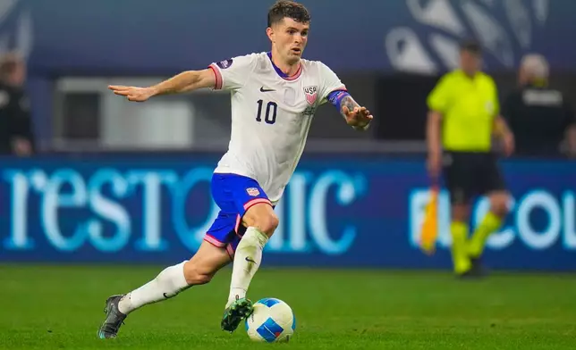 FILE - United States' Christian Pulisic dribbles during a CONCACAF Nations League championship soccer match between Mexico and the United States, Sunday, March 24, 2024, in Arlington, Texas. (AP Photo/Julio Cortez, File)