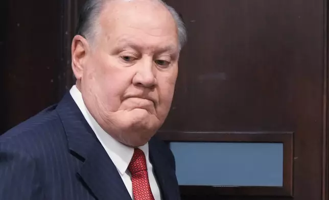 Defendant former FirstEnergy CEO Chuck Jones enters the court for a jury question in his case in Summit County Common Pleas Judge Susan Baker Ross' courtroom in Akron, Ohio, on Tuesday, March 31, 2026. (Mike Cardew/Akron Beacon Journal via AP, Pool)