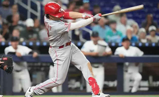 Cincinnati Reds' Sal Stewart hits a two-run home run during the fifth inning of a baseball game against the Miami Marlins, Wednesday, April 8, 2026, in Miami. (AP Photo/Lynne Sladky)